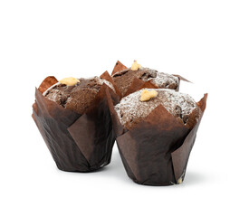 baked chocolate muffins with cream wrapped in brown paper