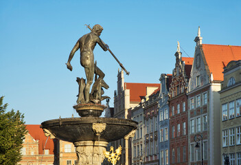 Neptune fountain and townhouse at Dluga (Long) street in Gdansk. Poland © Andrey Shevchenko