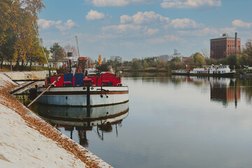 Fototapeta premium boat moored on a river city port