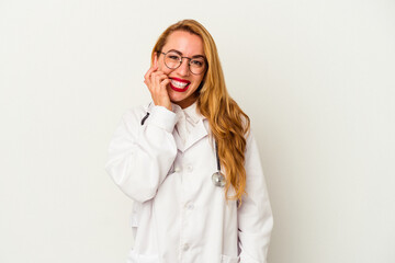 Caucasian doctor woman isolated on white background biting fingernails, nervous and very anxious.