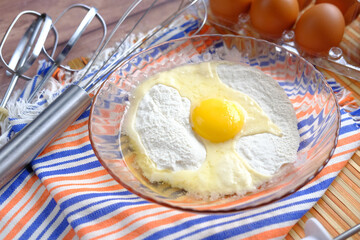 Baking ingredients on a wooden background, close up 