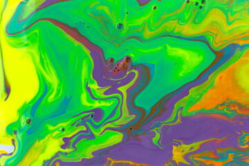Green and violet marble abstract acrylic background. Vivid artwork texture. Agate ripple pattern.