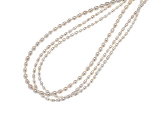 Lines of baroque pearls isolated on white background