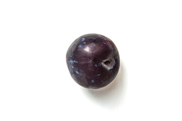 ripe round plum on a white background close-up