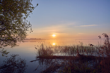 Fototapeta na wymiar Morning by the lake. Beautiful spring sunrise