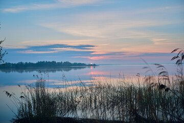 Fototapeta premium Morning by the lake. Beautiful spring sunrise