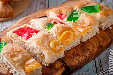 Coca de Sant Joan on wooden board, closeup shot