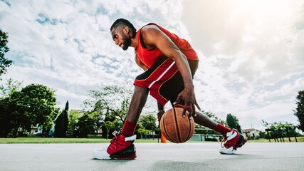 Basketball street player dribbling with ball on the court - Streetball, basket ball, training and...