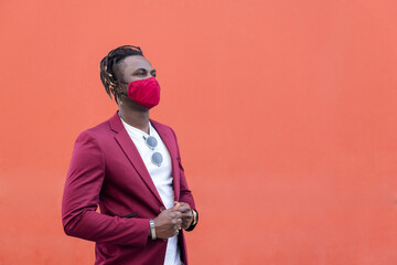elegant african man with mask to match his suit