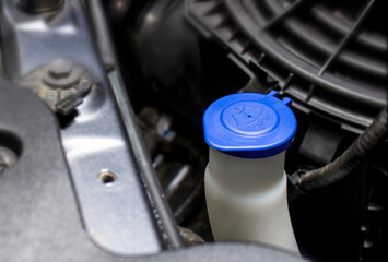Close up wiper tank in engine room for check water level for Clean the windshield of car basic of service concept