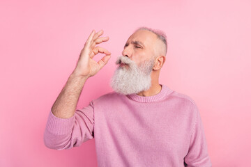 Profile photo of funny grey beard old man taste food wear pink sweater isolated on pastel color...