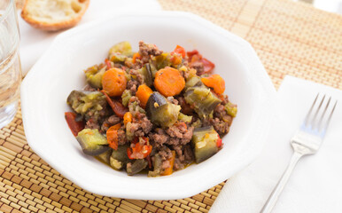 dish of vegetable stew. stewed eggplant, minced meat, carrots, peppers, onion squid