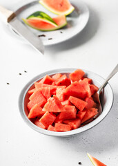 Delicious slices of summer watermelon in a bowl. Healthy food and lifestyle concept. Copy space.