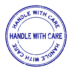 Grunge blue handle with care word round rubber seal stamp on white background