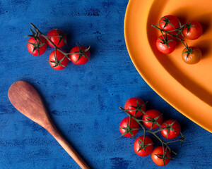 fresh tomatoes blue background