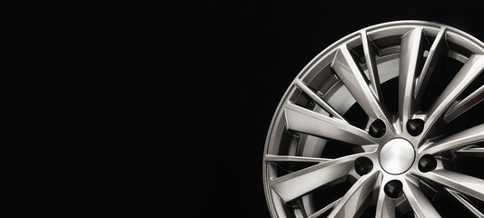 grey car alloy wheels, modern design. close-up photo of the new aluminum alloy wheel