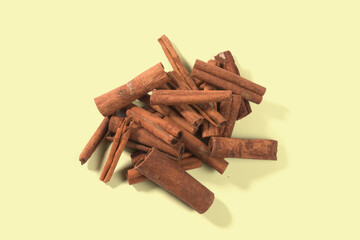 Aromatic dry cinnamon sticks on color background