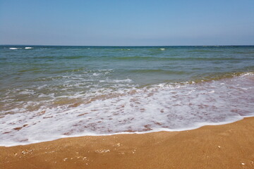 Wave of the sea on the sand beach