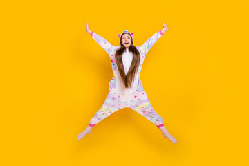 Fototapeta na wymiar Full length body size view of pretty cheerful carefree girl jumping having fun wear animal look isolated over bright yellow color background