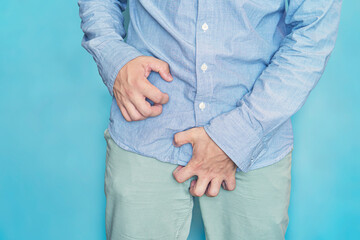 Man scratch the itch with hand, Penis, itching, Concept with Healthcare And Medicine. urinary incontinence. Itching in the groin. - obrazy, fototapety, plakaty