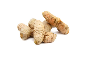 Turmeric spice rhizome isolated on white background. Heap of curcuma longa roots. Oriental spice