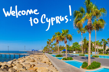 Limassol city in Cyprus. Welcome to Cyprus inscription over city of Limassol. Travel to  beaches of Cypriot. Limassol city marina with palm trees. Tourism in Cyprus. Cypriot resort landscape.