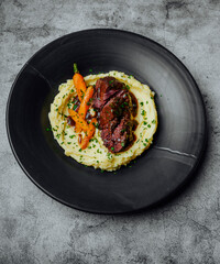 Beef cheeks with wine sauce and potato puree