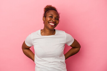 Young african american woman isolated on pink background happy, smiling and cheerful.