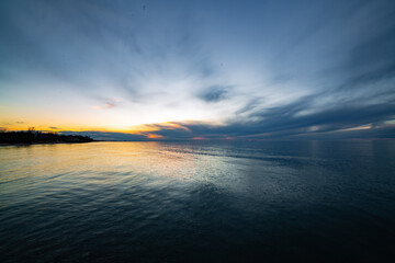 Sunset clouds over lake