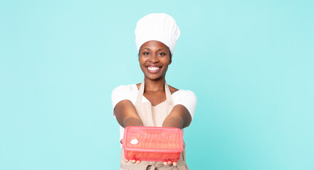 black african american adult chef woman with a tupperware