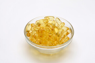 dietary supplement omega 3 in a glass bowl, close-up
