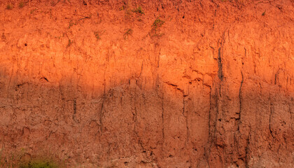 Industrial sand quarry close up, sand excavation texture at sunset