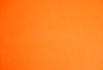 Fototapeta premium Orange background. The texture of the cardboard.