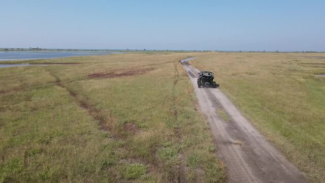 ATV across the field in the mud
