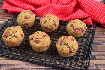 strawberry muffins on cooling rack