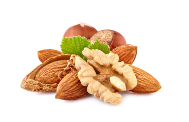 Almonds, walnut and hazelnuts  with leaves in closeup isolated on white background.