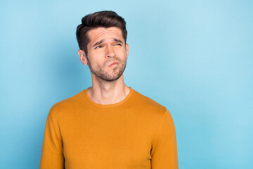 Fototapeta premium Photo of young man think thoughtful guess wonder minded dream uncertain look empty space isolated over blue color background