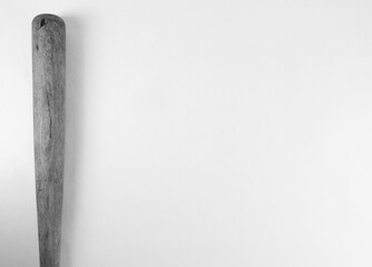 Wooden baseball bat in black and white isolated on background for textured vintage sport equipment.