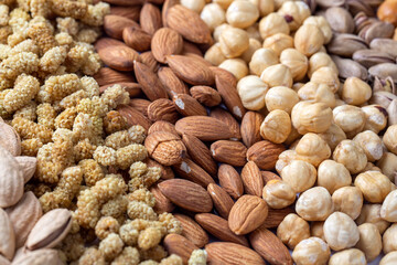 Mixed nuts on the stone background