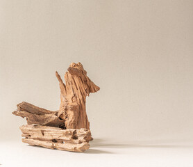 Weathered wood pieces on a warm grey background