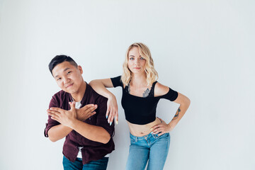 beautiful man and woman joint portrait on a light background