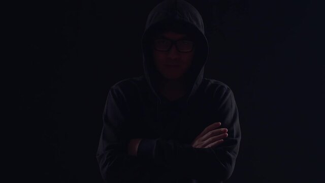 Asian Hacker Pose On Black Background

