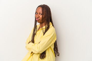 Young african american woman isolated on white background frowning face in displeasure, keeps arms...