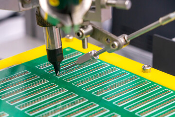 The soldering robot operation with PCB board. The hi-technology electronics industry assembly process by robotic system.