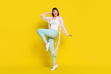 Fototapeta na wymiar Full body photo of dreamy cheerful young happy woman look empty space isolated on yellow color background