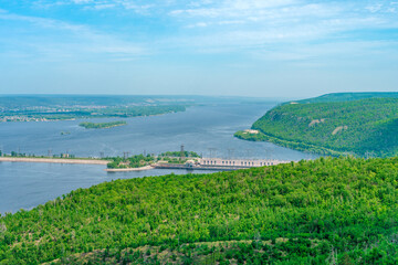 Panorama of mountains with a dense forest and the Volga River on the background, photographed from a height. Nature of Russia