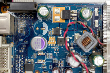 A microchip with components in close-up. Processor with resistors, transistors and chip components