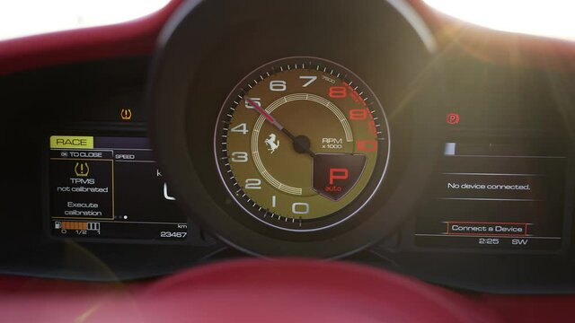 dashboard of a sports car. speedometer and tachometer close-up