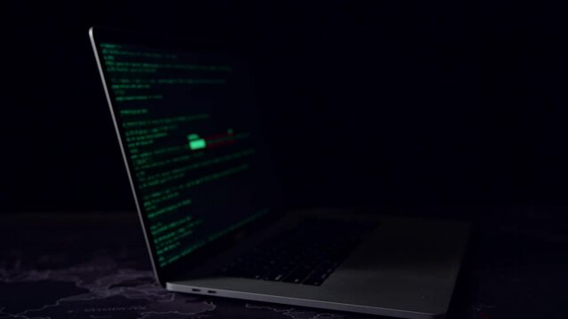 Display Of Laptop Computer Hacking And Downloading Data In The Dark Room
