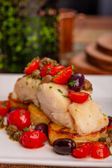 Peixe em cama de legumes